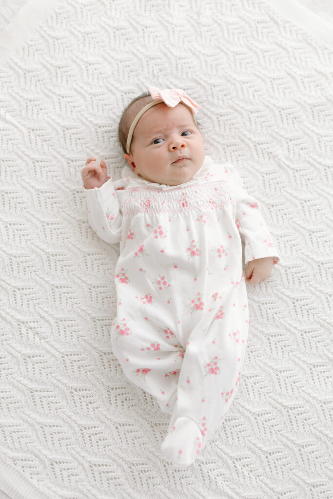 baby girl looking towards camera in studio newborn photos in indianapolis
