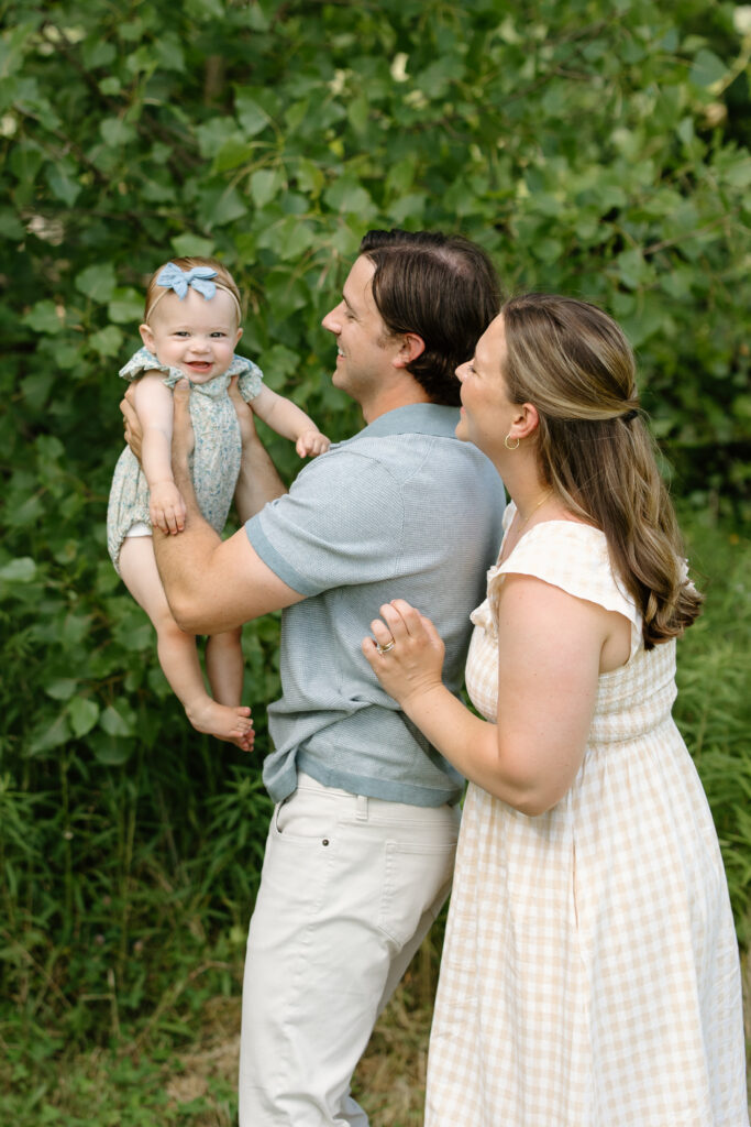 dad lifting little girl during Indianapolis Milestone Photography session