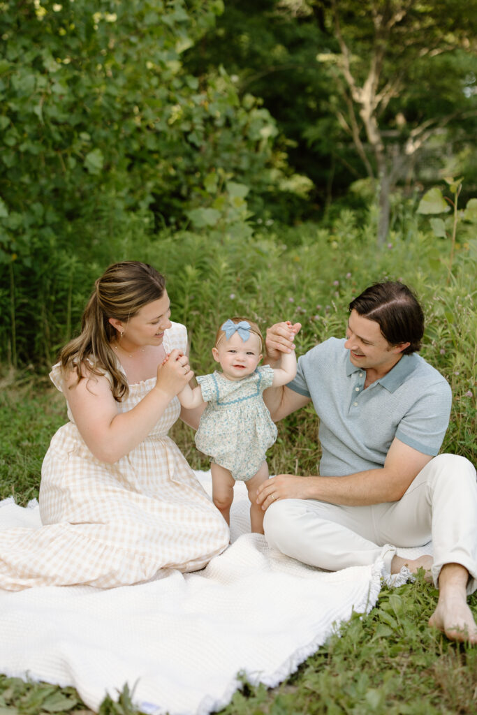 Parents playing with little girl during Indianapolis Milestone Photography session