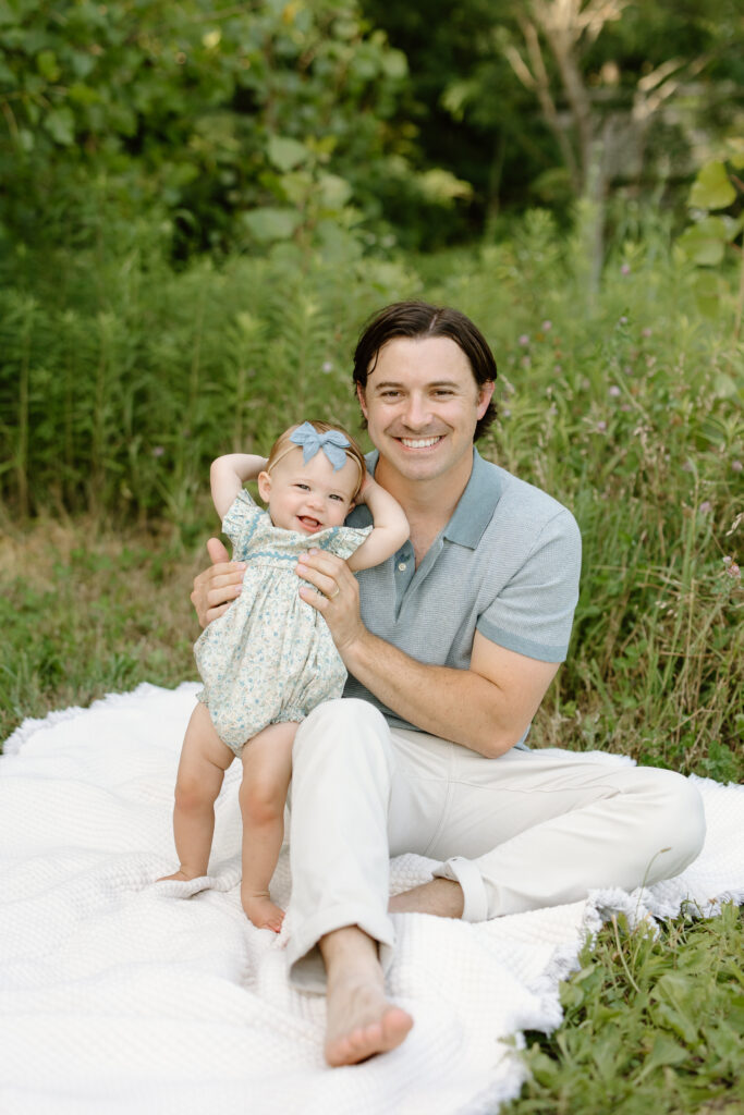 Dad holding little girl in standing during Indianapolis Milestone Photography session