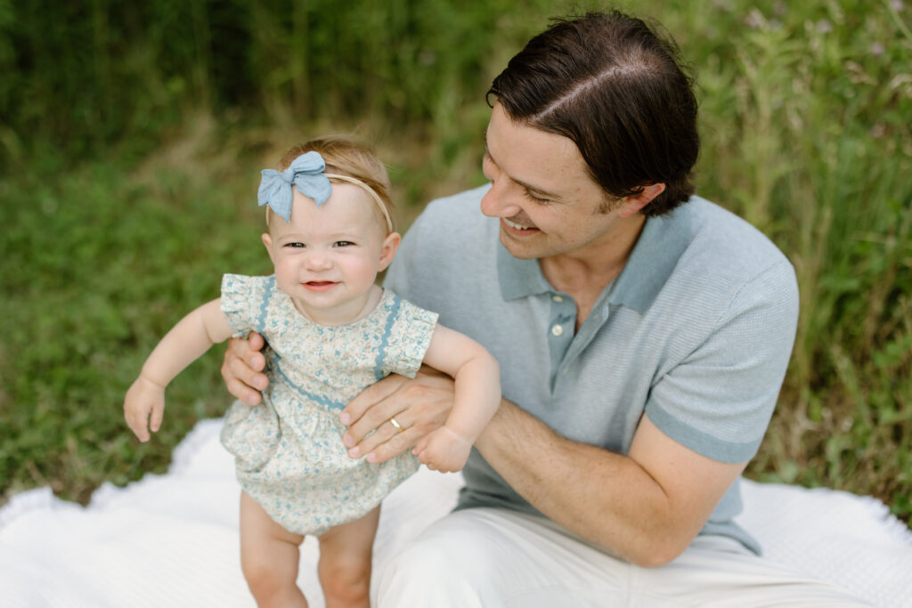 Dad holding little girl during Indianapolis Milestone Photography session