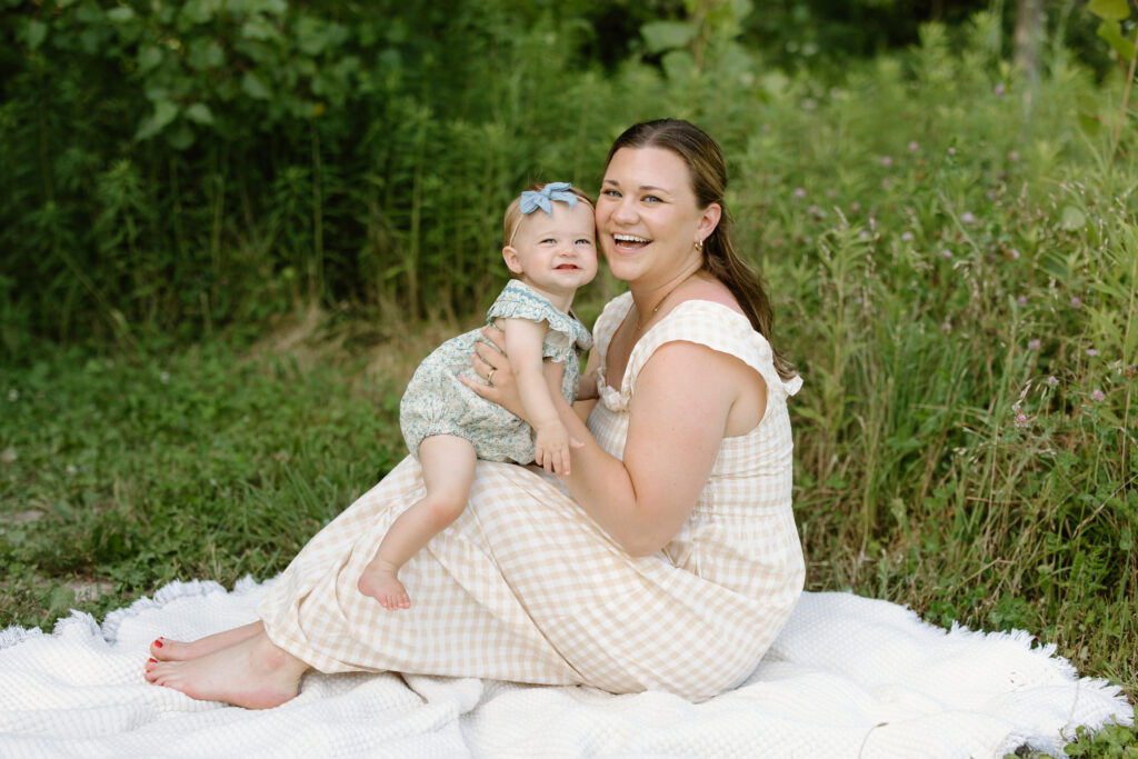 Mom and little girl smiling towards camera during Indianapolis Milestone Photography session