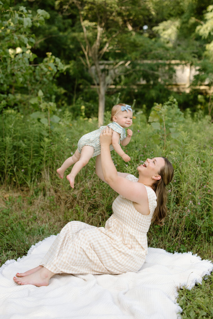 Mom lifting baby into air during Indianapolis Milestone Photography session