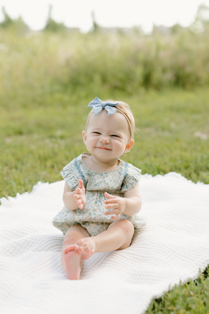 little girl scrunching her face and smiling during Indianapolis Milestone Photography session