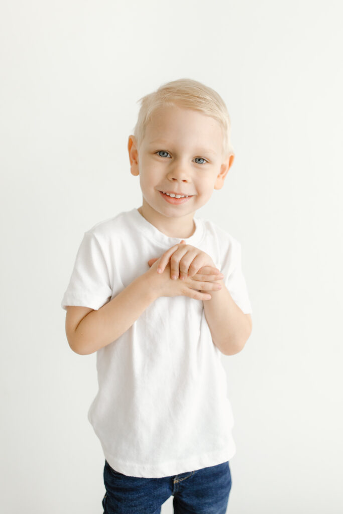 Little boy smiling towards camera during Mother's Day Mini Sessions at Aspiring Eden Studio in Indianapolis