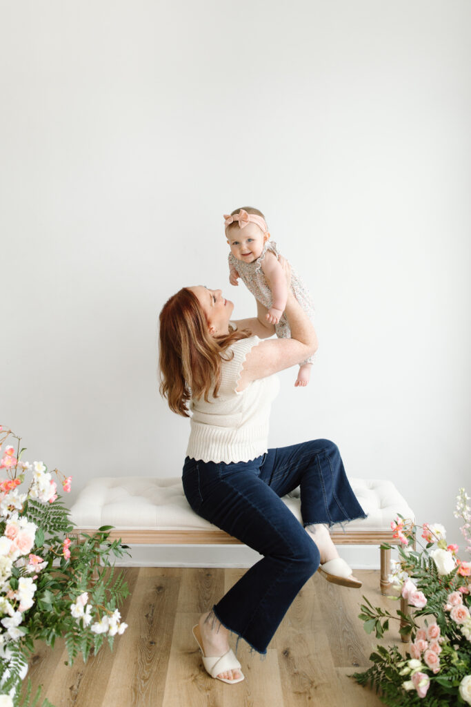 Mom lifting daughter overhead during Mother's Day Mini Sessions at Aspiring Eden Studio in Indianapolis