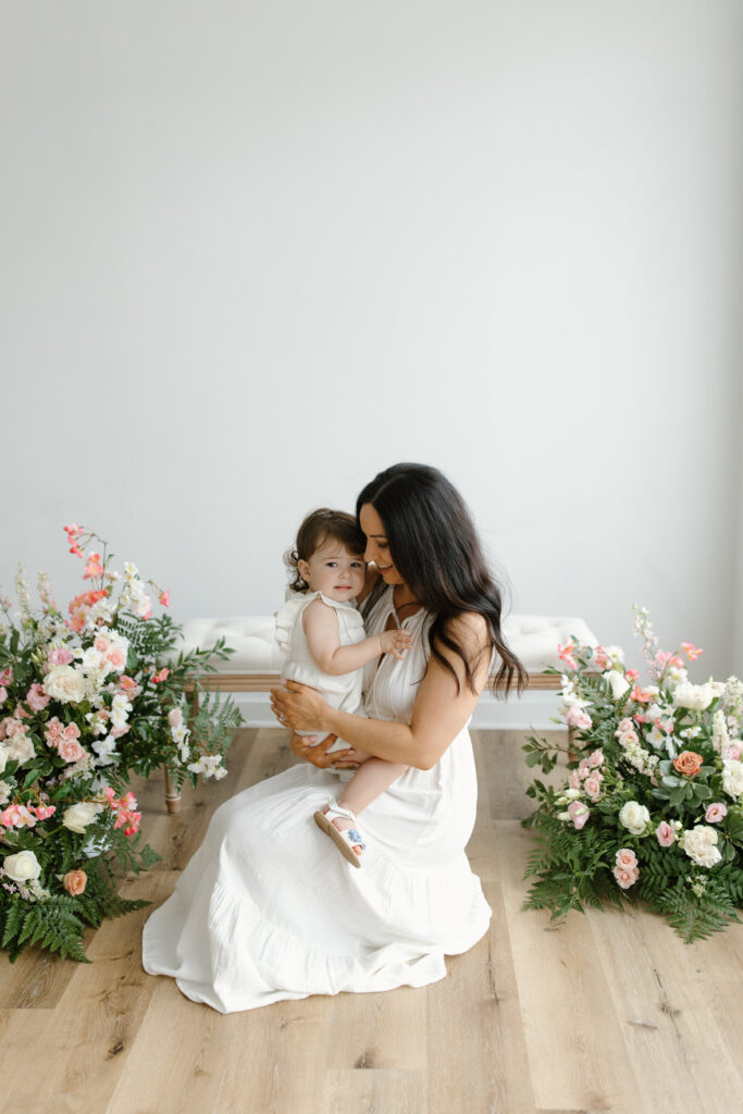 Mom and daughter snuggling during Mother's Day Mini Sessions at Aspiring Eden Studio in Indianapolis