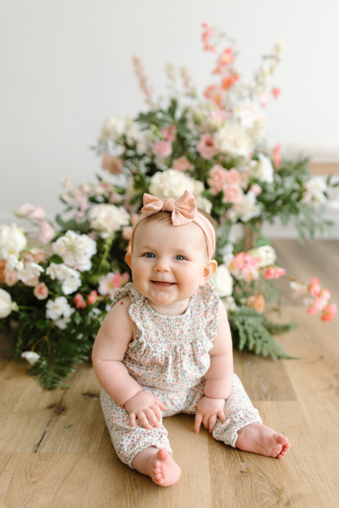 Baby girl smiling to camera during Mother's Day Mini Sessions at Aspiring Eden Studio in Indianapolis
