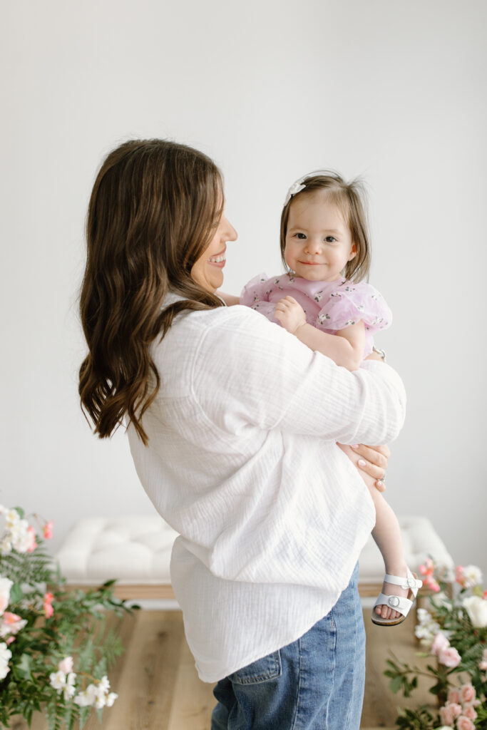 Mom holding daughter during Mother's Day Mini Sessions at Aspiring Eden Studio in Indianapolis