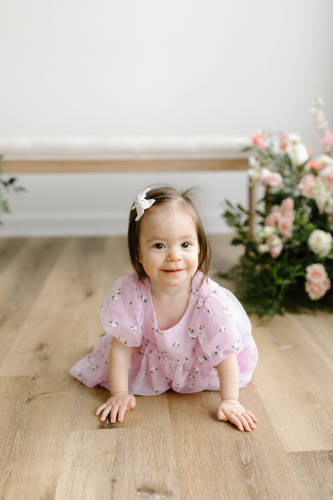 Baby girl crawling to camera during Mother's Day Mini Sessions at Aspiring Eden Studio in Indianapolis