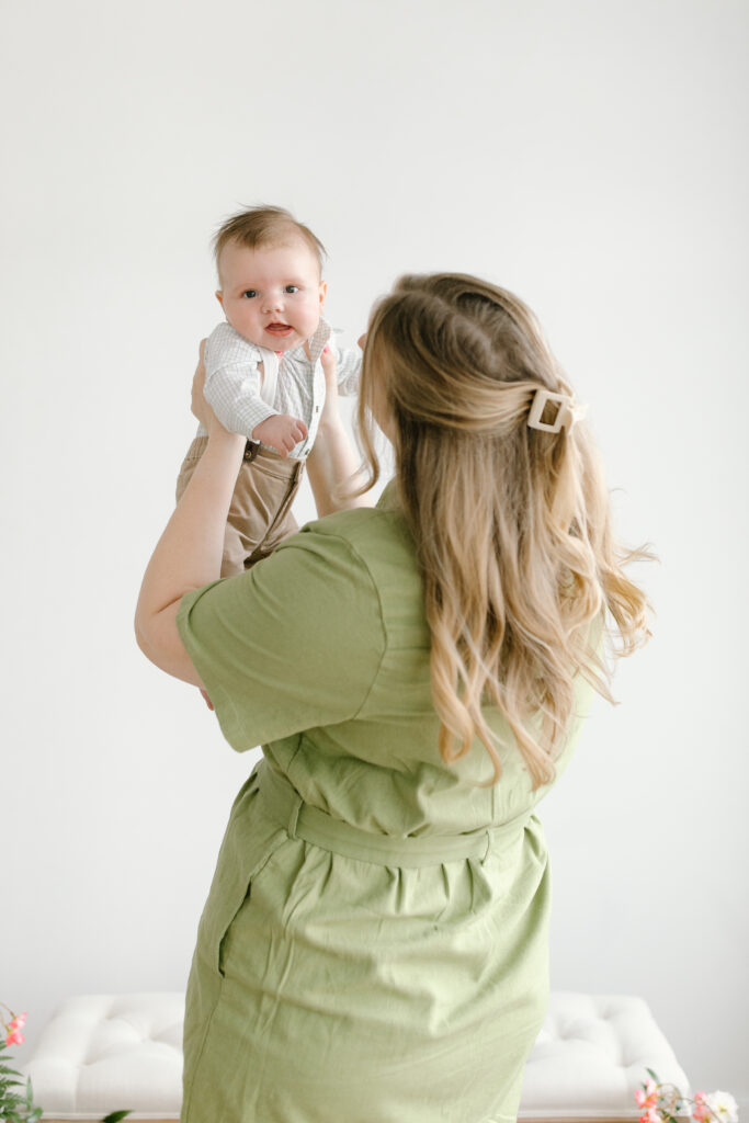 Mom lifting son during Mother's Day Mini Sessions at Aspiring Eden Studio in Indianapolis