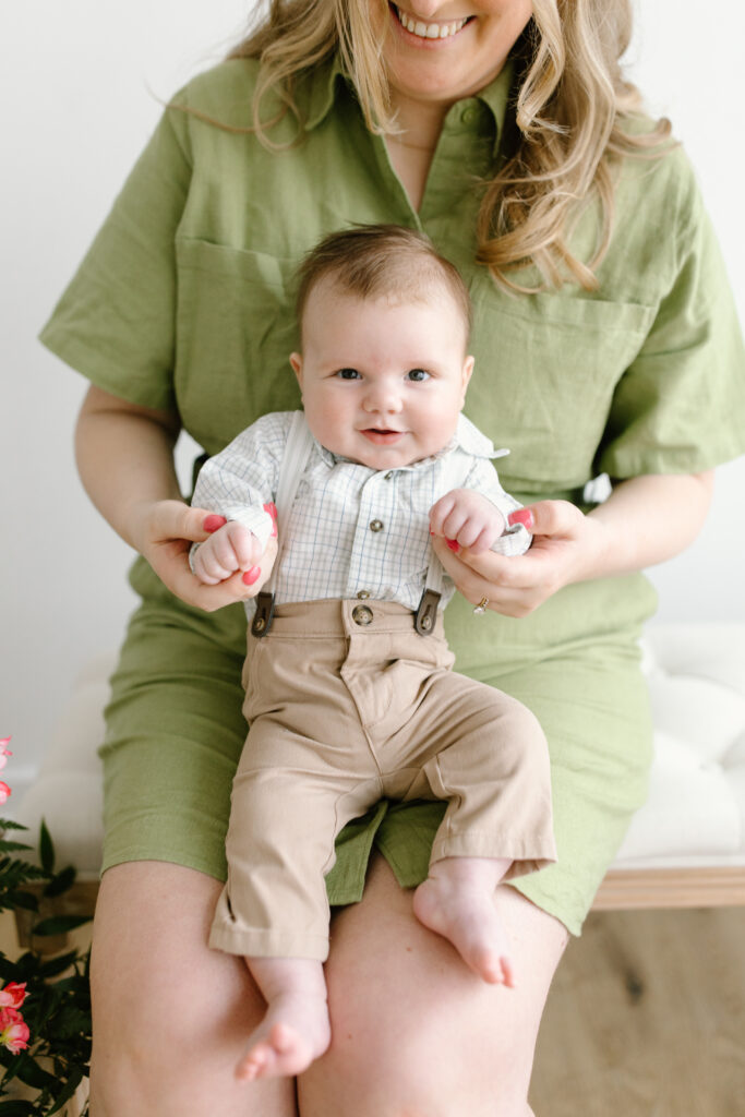 Baby boy smiling towards the camera during Mother's Day Mini Sessions at Aspiring Eden Studio in Indianapolis