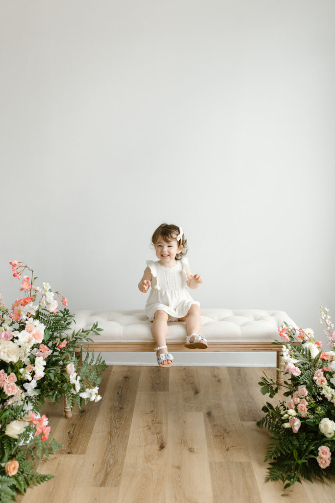 Little girl smiling to camera during Mother's Day Mini Sessions at Aspiring Eden Studio in Indianapolis