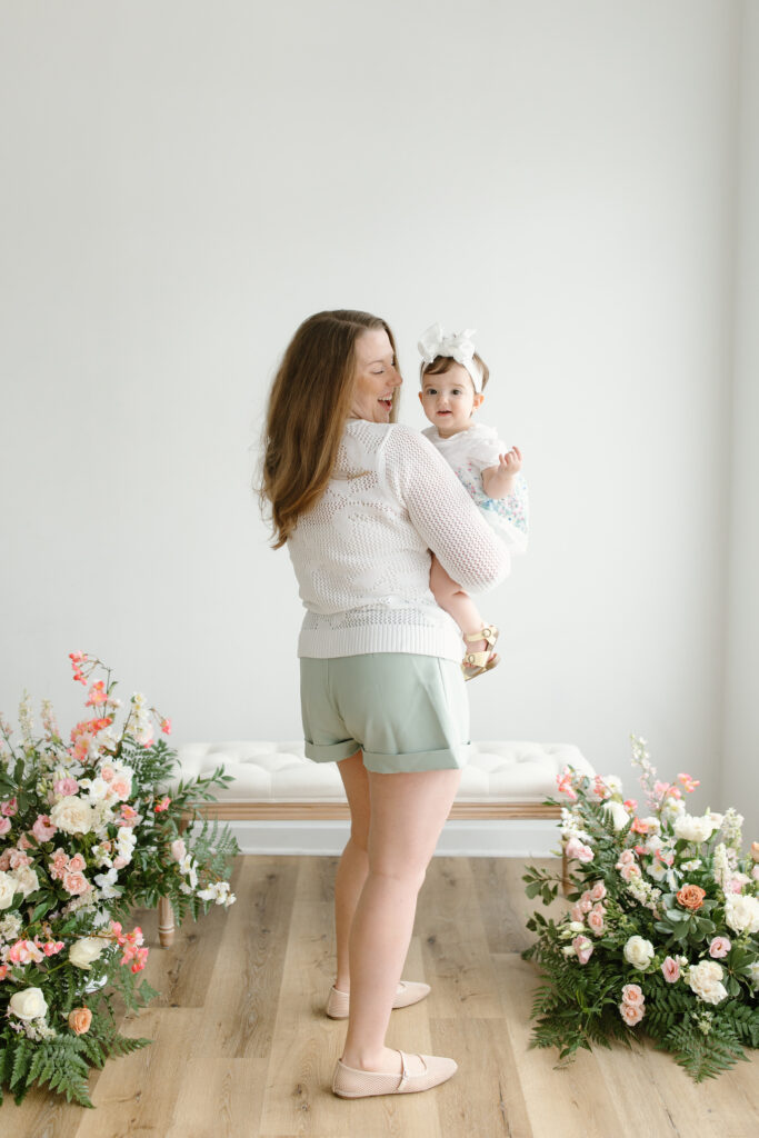 Mom holding daughter during Mother's Day Mini Sessions at Aspiring Eden Studio in Indianapolis
