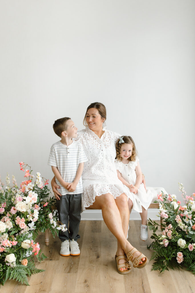 Family sitting on the bench during Mother's Day Mini Sessions at Aspiring Eden Studio in Indianapolis