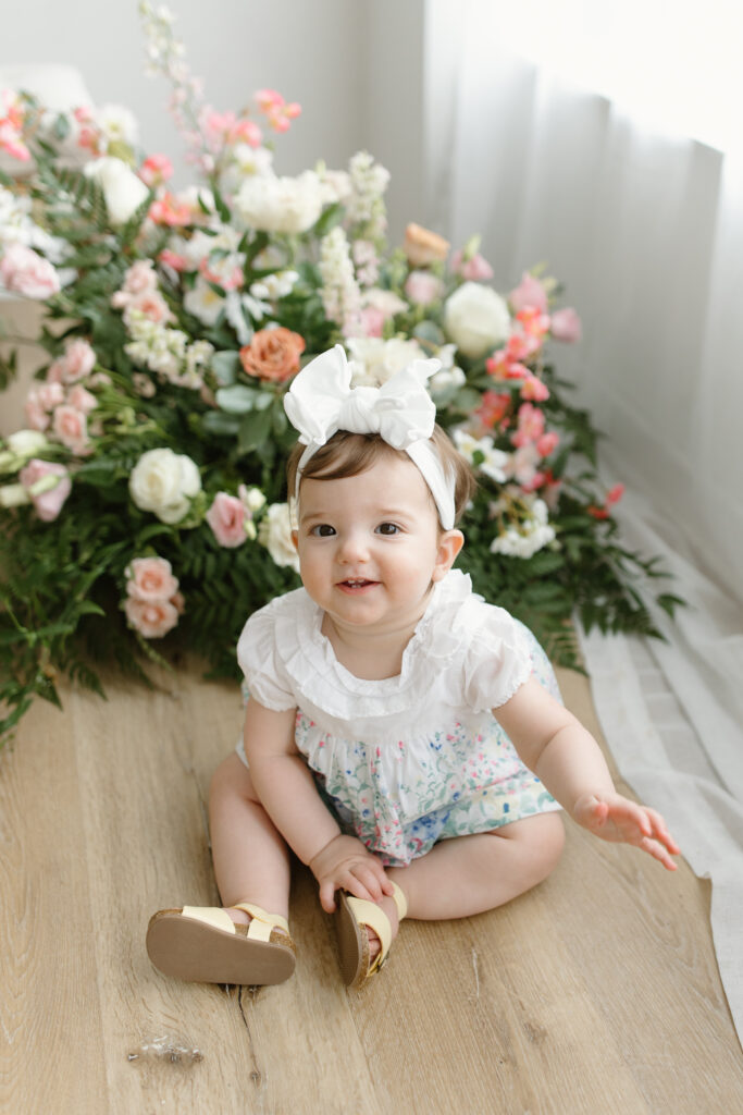 Baby girl smiling to camera during Mother's Day Mini Sessions at Aspiring Eden Studio in Indianapolis