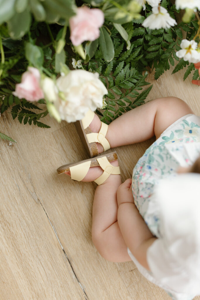 Detail photo of little girl's yellow shoes during Mother's Day Mini Sessions at Aspiring Eden Studio in Indianapolis