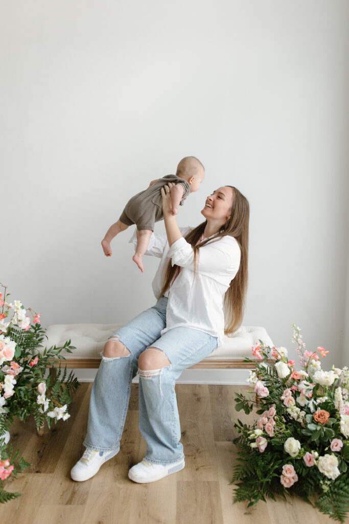 Mom lifting son during Mother's Day Mini Sessions at Aspiring Eden Studio in Indianapolis