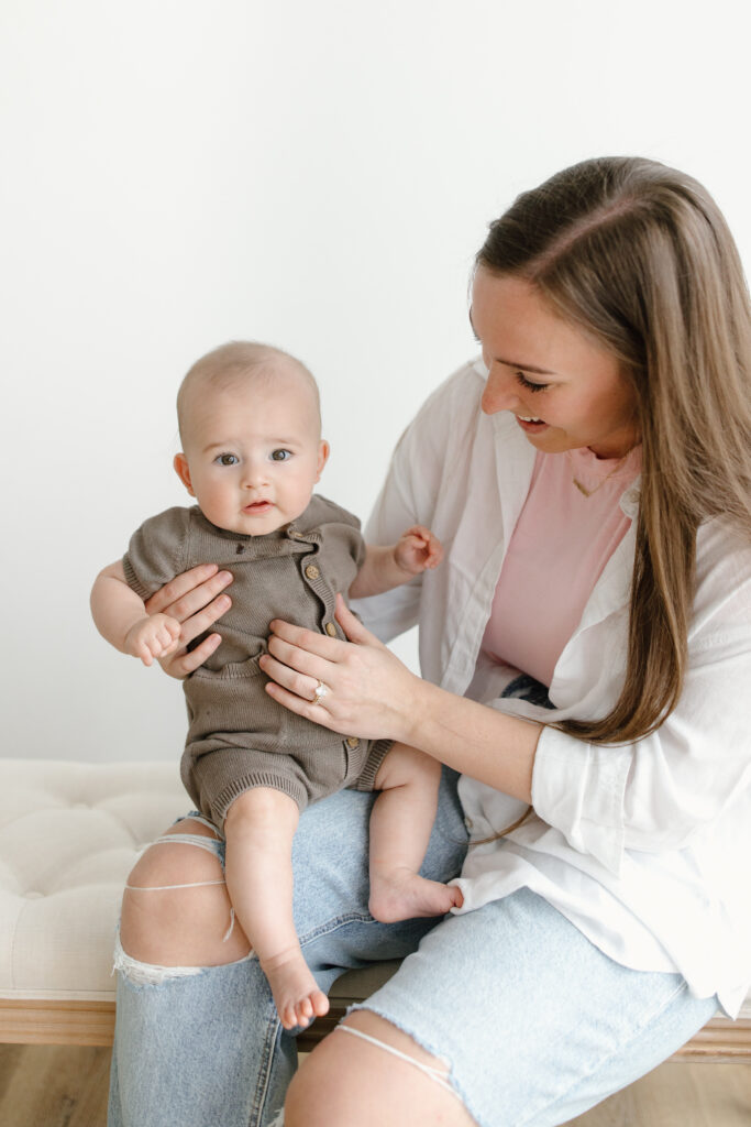 Little boy held by mom during Mother's Day Mini Sessions at Aspiring Eden Studio in Indianapolis