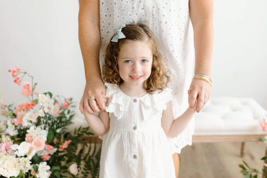 Girl smiling to camera during Mother's Day Mini Sessions at Aspiring Eden Studio in Indianapolis