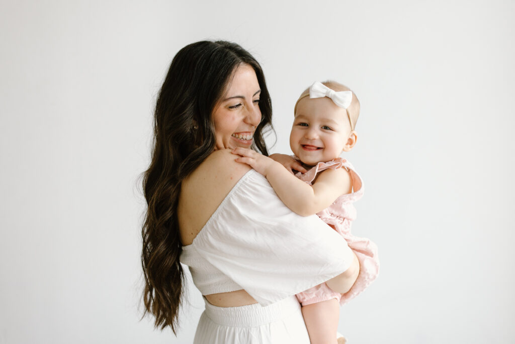 Mom laughing at her daughter during Mother's Day Mini Sessions at Aspiring Eden Studio in Indianapolis