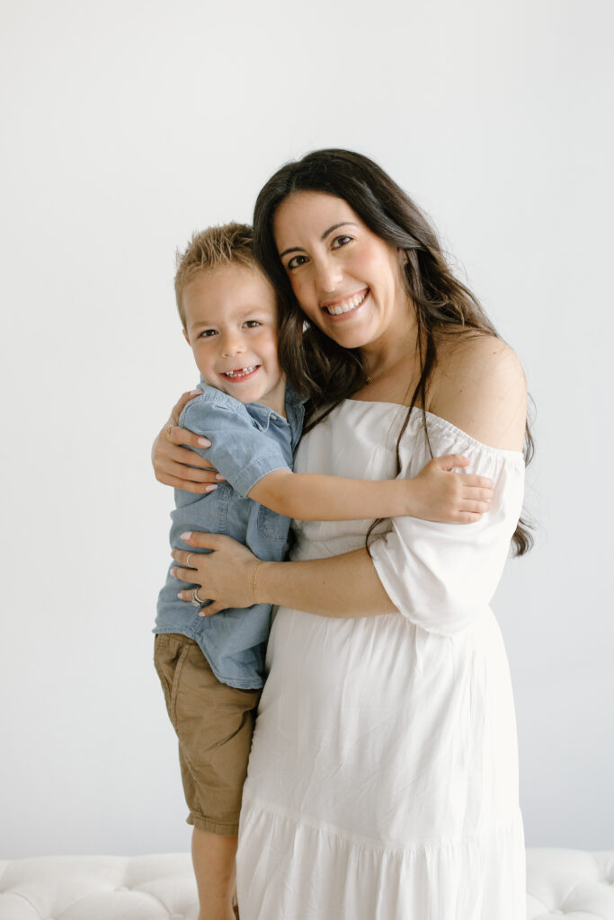 Mom hugging her son during Mother's Day Mini Sessions at Aspiring Eden Studio in Indianapolis