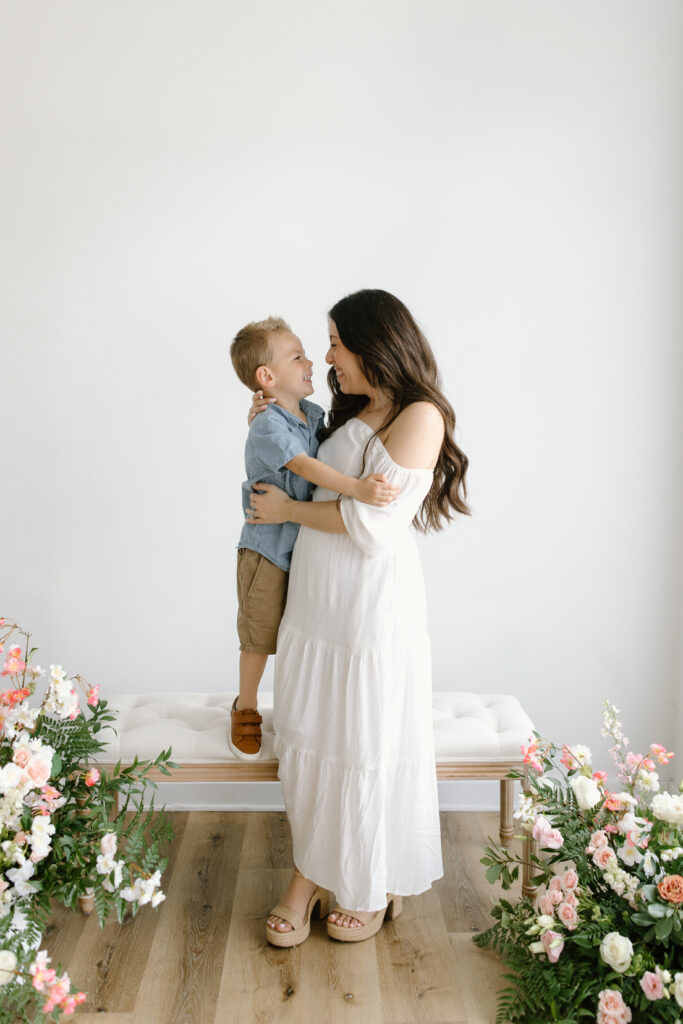 Mom smiling in towards her son during Mother's Day Mini Sessions at Aspiring Eden Studio in Indianapolis