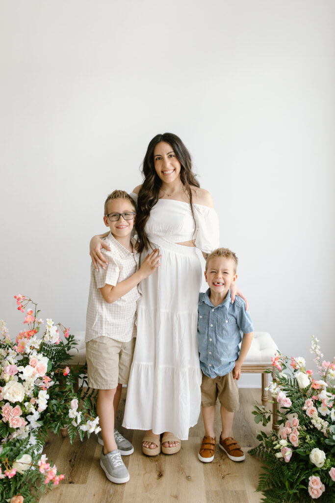 Mom hugging her sons during Mother's Day Mini Sessions at Aspiring Eden Studio in Indianapolis