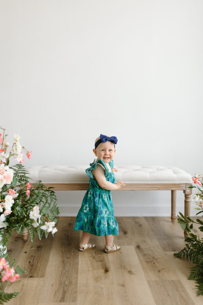 Little girl smiling towards camera during Mother's Day Mini Sessions at Aspiring Eden Studio in Indianapolis