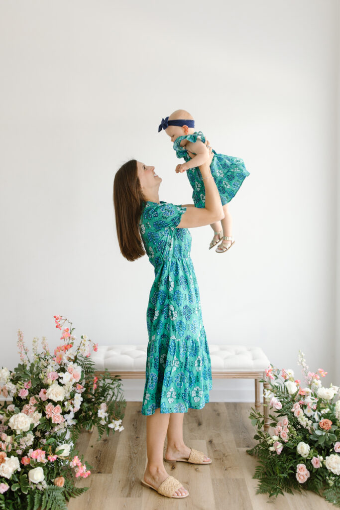 Mom lifting daugther during Mother's Day Mini Sessions at Aspiring Eden Studio in Indianapolis