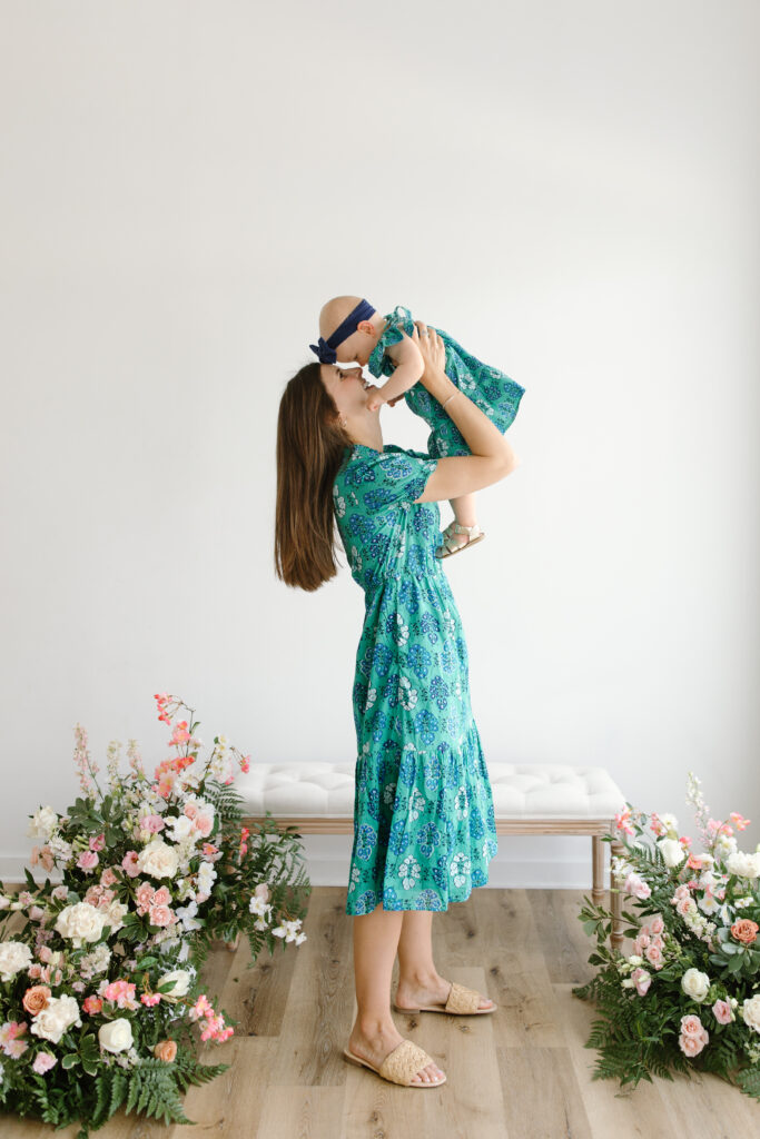 Mom and daughter forehead to forehead during Mother's Day Mini Sessions at Aspiring Eden Studio in Indianapolis