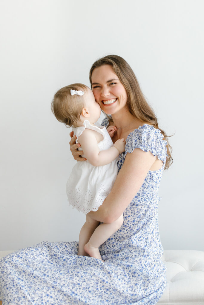 Daughter kissing mom during Mother's Day Mini Sessions at Aspiring Eden Studio in Indianapolis
