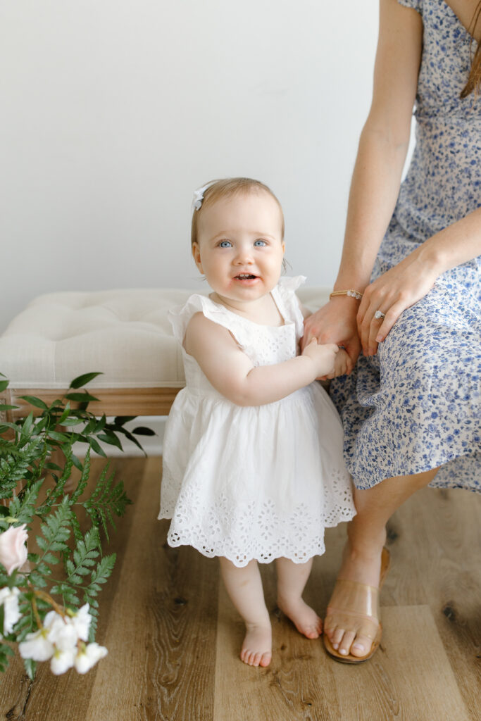 Little girl smiling towards camera during Mother's Day Mini Sessions at Aspiring Eden Studio in Indianapolis