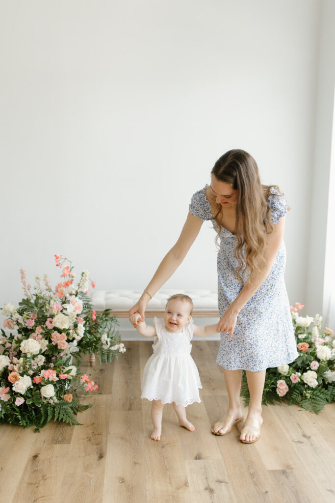 Mom and daughter dancing during Mother's Day Mini Sessions at Aspiring Eden Studio in Indianapolis