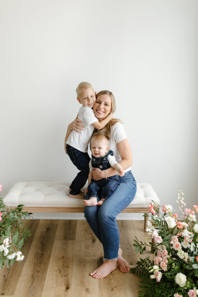 Mom hugging sons during Mother's Day Mini Sessions at Aspiring Eden Studio in Indianapolis