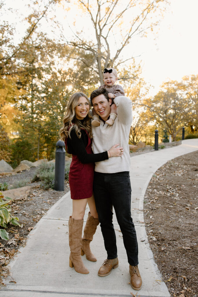 Joyful family having family photos taken during fall mini sessions with capturing simplicity photography in Carmel, IN