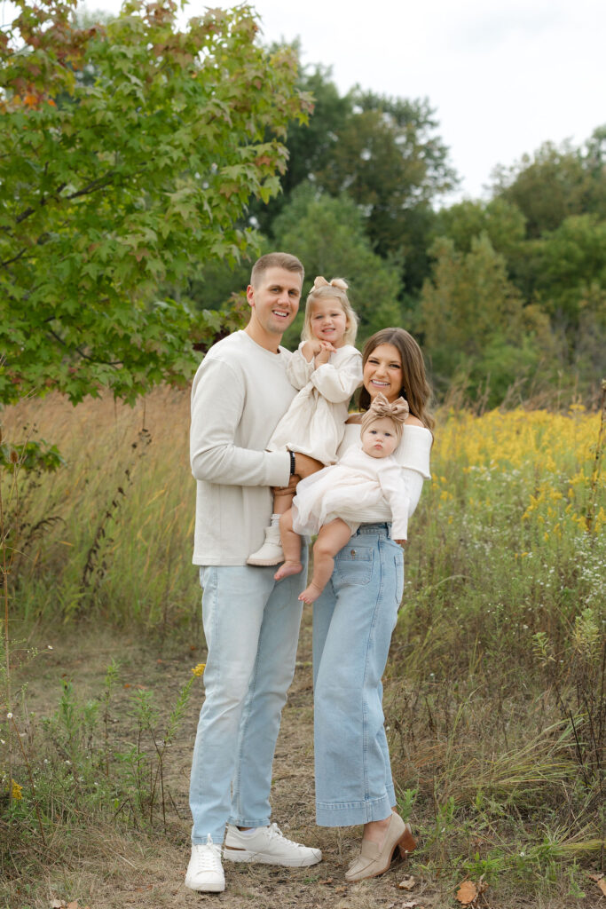 Family smiling during fall family photos at West Park in with Capturing Simplicity Photography