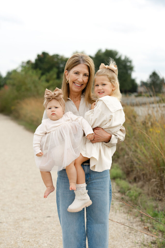 Grandma and girls smiling during fall family photos at West Park in with Capturing Simplicity Photography