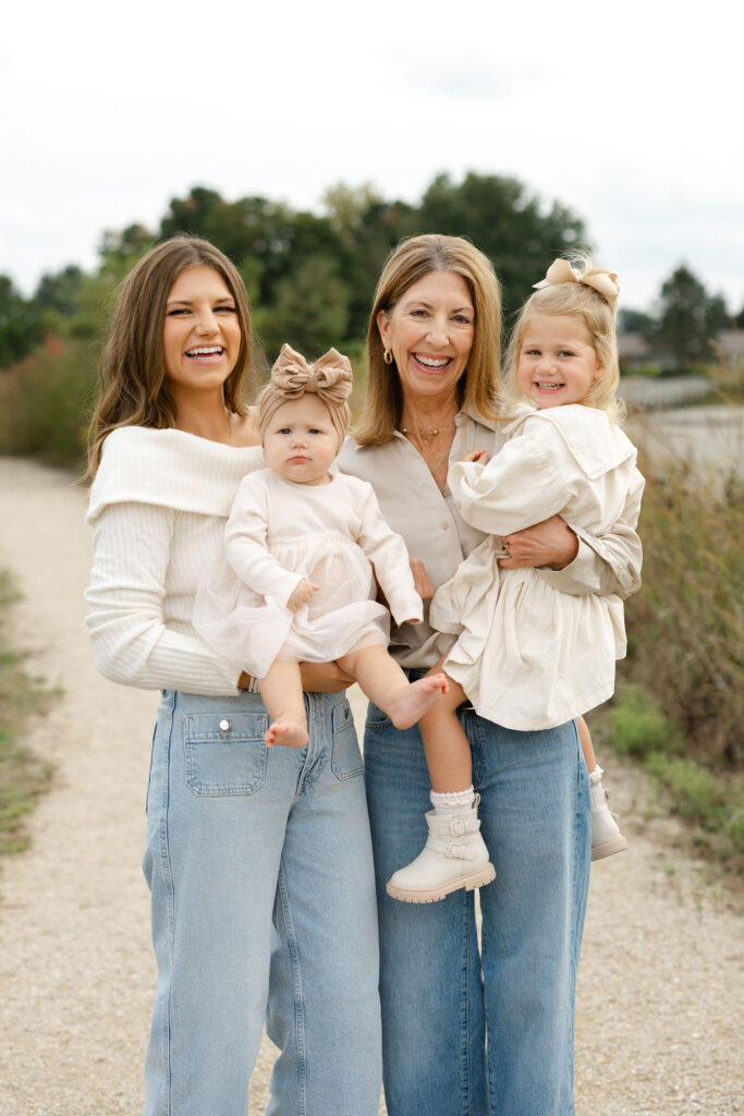 Mom, Grandma, and girls laughing during fall family photos at West Park in with Capturing Simplicity Photography