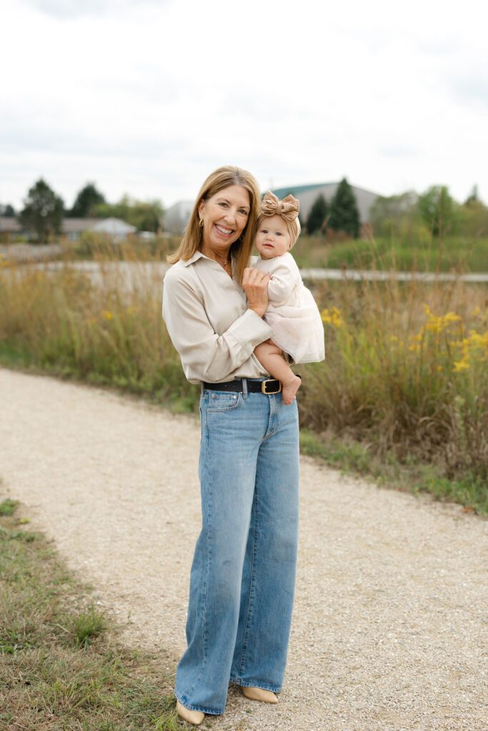 Grandma holding baby girl during fall family photos at West Park in with Capturing Simplicity Photography