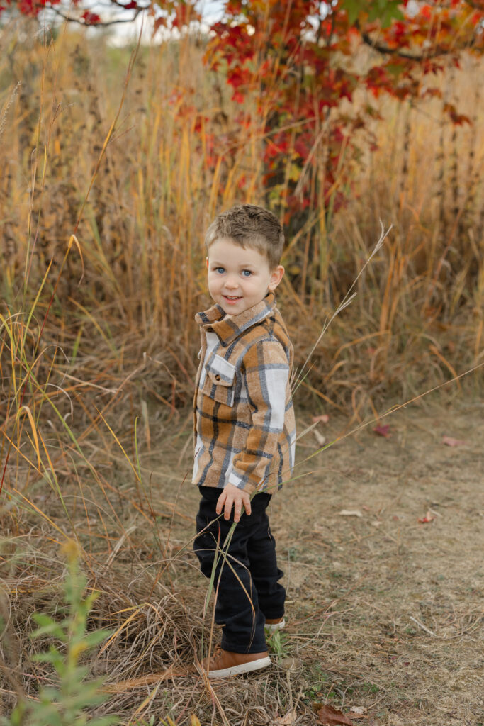 Little boy exploring during Fall Mini Sessions at West Park with Capturing Simplicity Photography