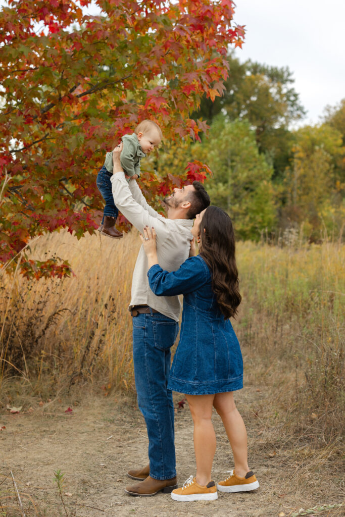 Family playing airplane during Fall Mini Sessions at West Park with Capturing Simplicity Photography