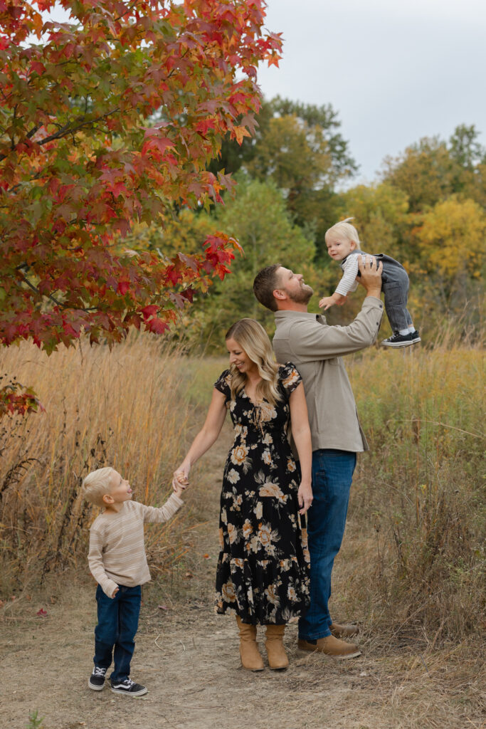 Family playing during Fall Mini Sessions at West Park with Capturing Simplicity Photography