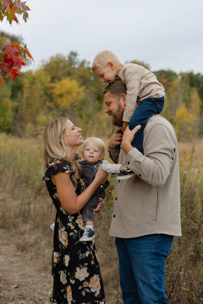 Boy up on shoulders during Fall Mini Sessions at West Park with Capturing Simplicity Photography