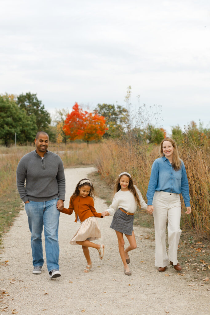 Family dancing during Fall Mini Sessions at West Park with Capturing Simplicity Photography