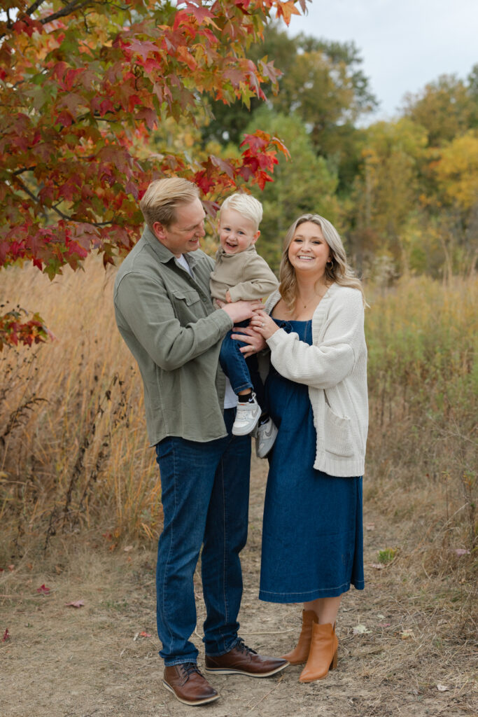 Family having a tickle fight during Fall Mini Sessions at West Park with Capturing Simplicity Photography