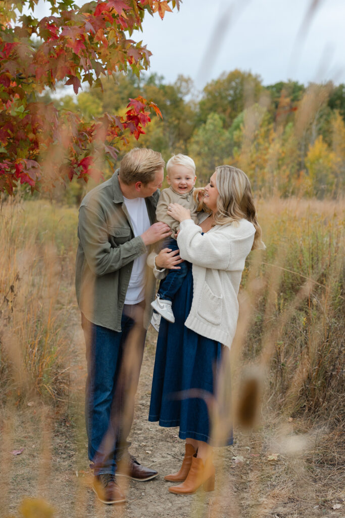 Family exploring a path during Fall Mini Sessions at West Park with Capturing Simplicity Photography