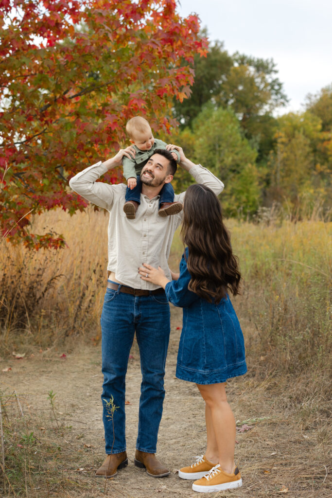 Dad playing with little boy during Fall Mini Sessions at West Park with Capturing Simplicity Photography