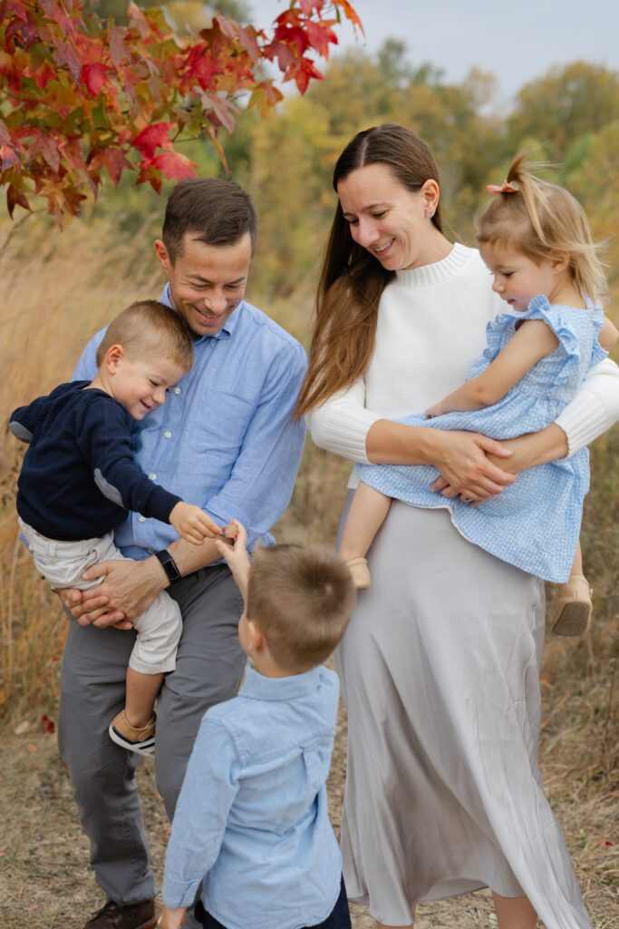Family playing during Fall Mini Sessions at West Park with Capturing Simplicity Photography