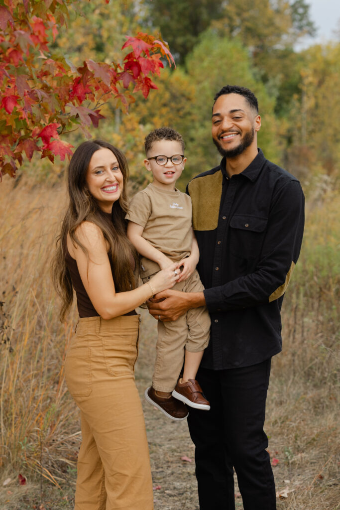 Family smiling during Fall Mini Sessions at West Park with Capturing Simplicity Photography